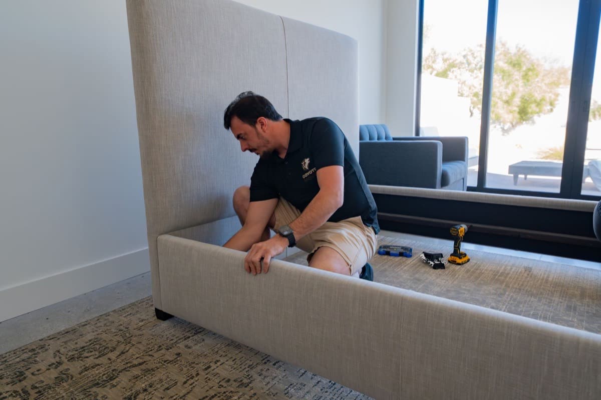 Coyotes Moving crew members assembling furniture during a Henderson move
