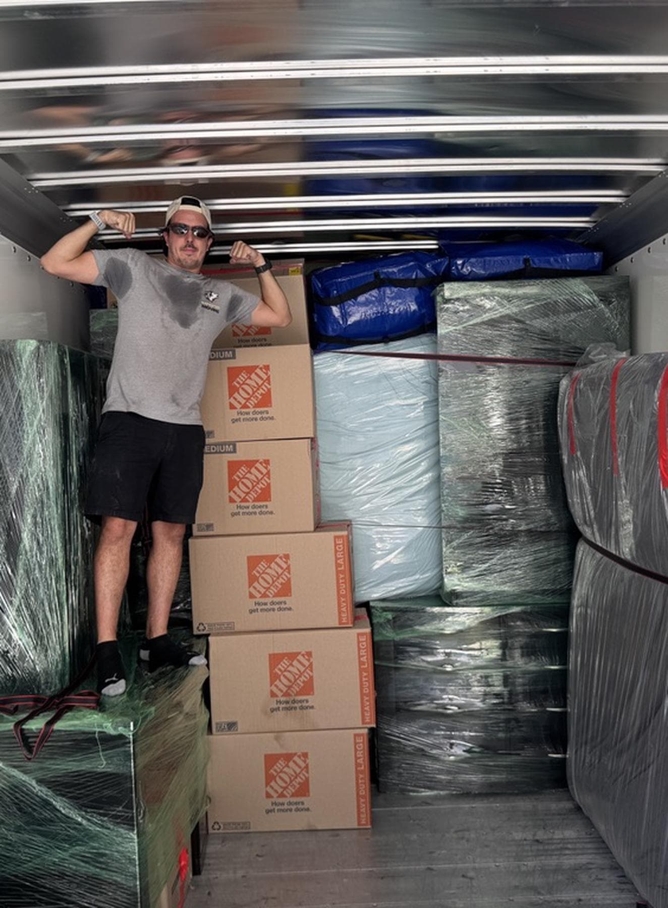 Coyotes Moving crew members carrying furniture during a Spring Valley move