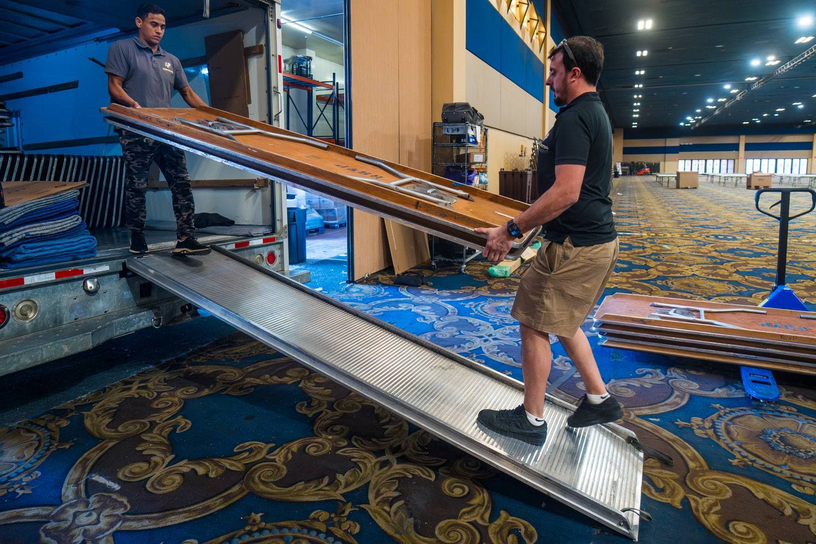 Coyotes Moving crew moving office furniture during a commercial relocation